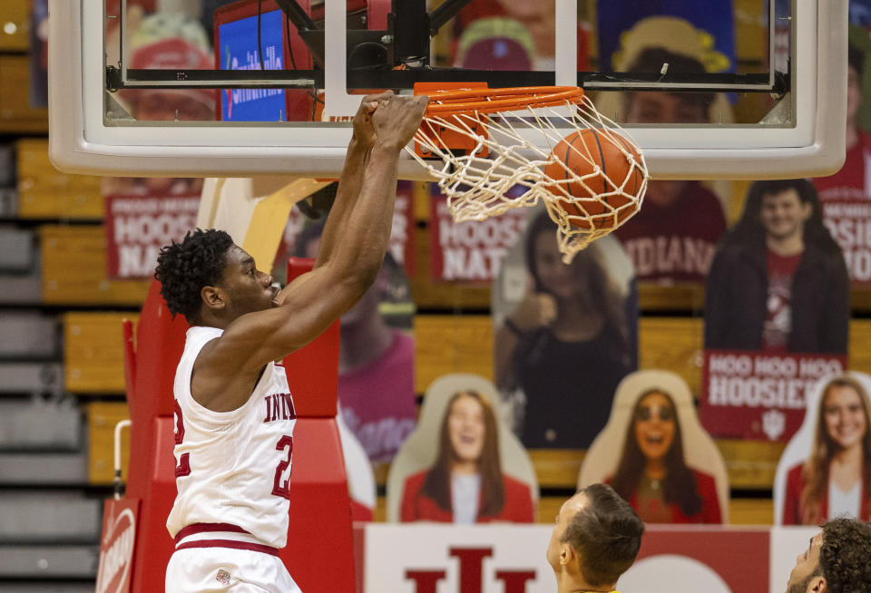 Indiana forward Jordan Geronimo (22) scores with a slam dunk during the first half of an NCAA college basketball game against Iowa, Sunday, Feb. 7, 2021, in Bloomington, Ind. (AP Photo/Doug McSchooler)