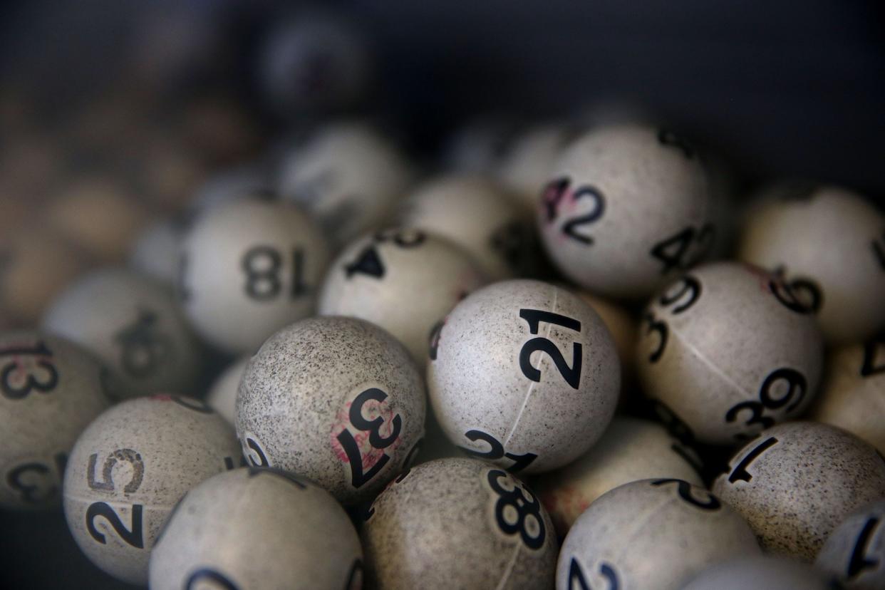 Lottery balls are seen in a box. (Photo by Justin Sullivan/Getty Images)