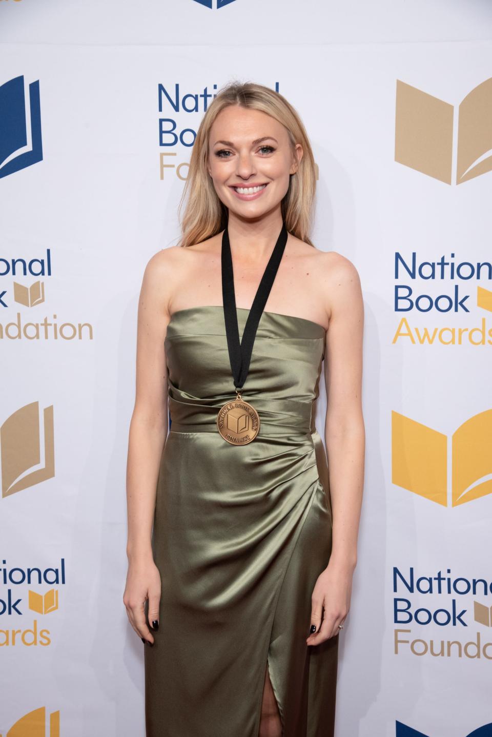 South Bend native Tess Gunty wears the medal she received for winning the National Book Award for fiction for her debut novel, "The Rabbit Hutch," at the 73rd National Book Awards Dinner and Ceremony on Nov. 16, 2022, at Cipriani Wall Street in New York City.