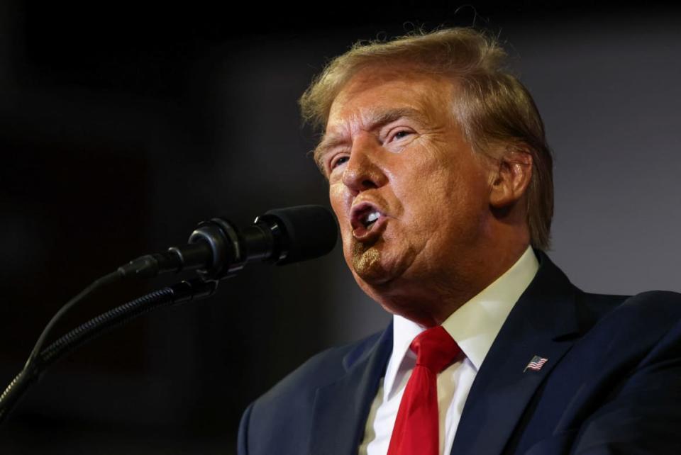 Former President Donald Trump speaks as he holds a campaign rally at Coastal Carolina University ahead of the South Carolina Republican presidential primary.