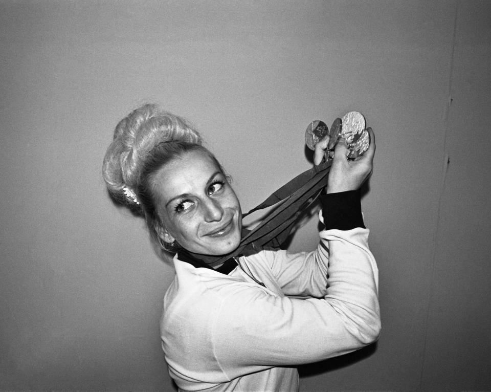 Vera Caslavska of Czechoslovakia displays the four medals she won in Olympic gymnastic competition.  Vera won three gold and one silver to add to the gold and silver ones she won.  She's the first competitor in Olympic history to win four individual gold medals in one Olympics.  (Photo by Bettmann Archive/Getty Images)