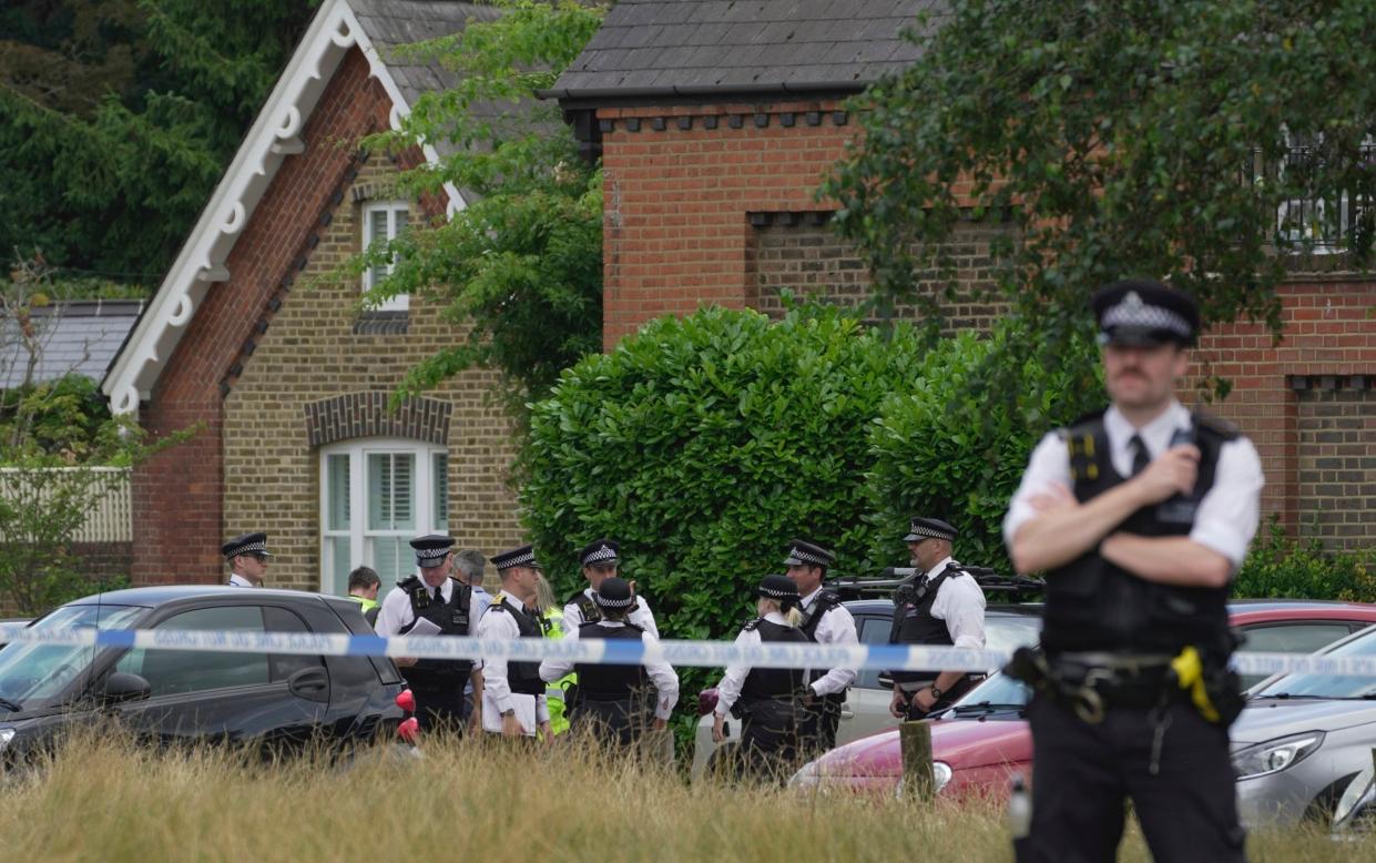 Police officers at Study Preparatory in Wimbledon after a car crashed into the primary school building killing two children