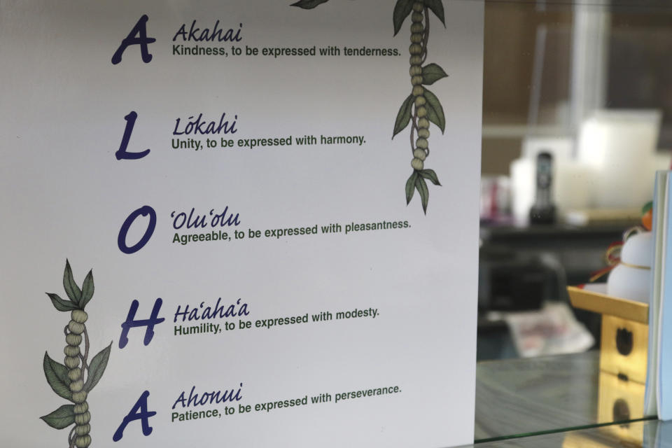 This Tuesday, April 16, 2019 photo shows a sign inside Aloha Poke Shop, a store in Honolulu that received a letter from Chicago-based Aloha Poke Co. saying the Illinois company had trademarked "Aloha Poke" and the Hawaii company would need to change its name. Hawaii lawmakers are considering adopting a resolution calling for the creation of legal protections for Native Hawaiian cultural intellectual property. (AP Photo/Audrey McAvoy)