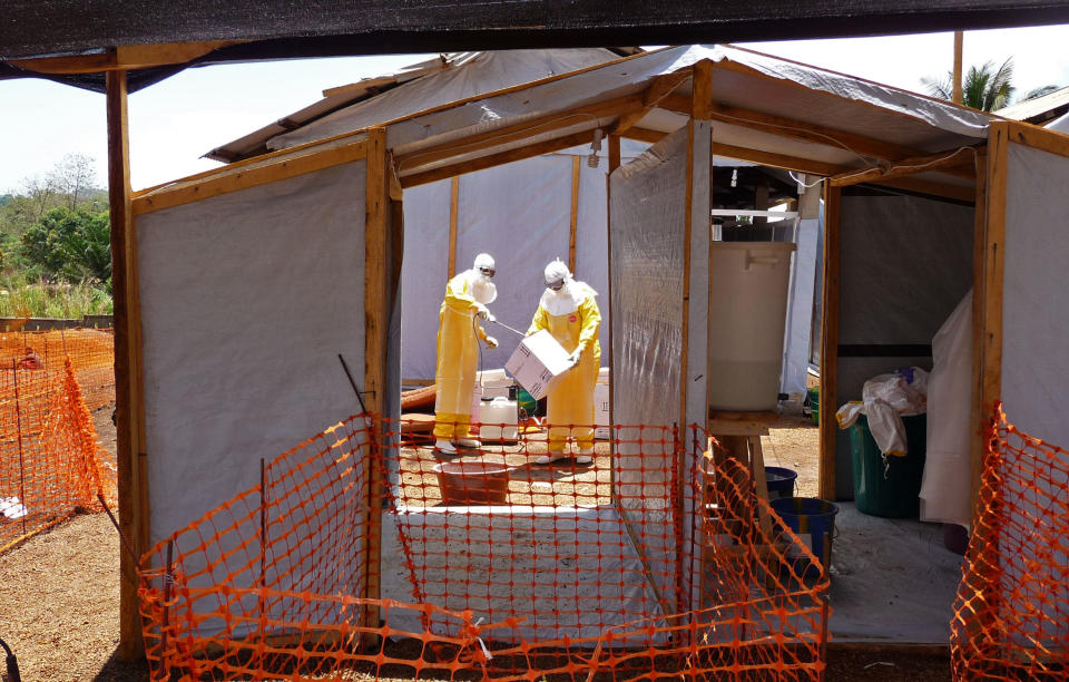 In this photo provide by MSF, Medecins Sans Frontieres (Doctors without Borders), taken on Friday, March 28, 2014, healthcare workers from the organisation prepare isolation and treatment areas for their Ebola, hemorrhagic fever operations, in Gueckedou, Guinea. (AP Photo/Kjell Gunnar Beraas, MSF)