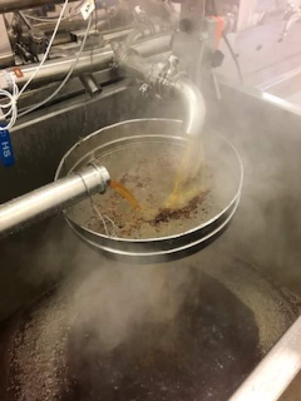 Maple syrup being drawn off an evaporator at Shady Grove Maple Company.