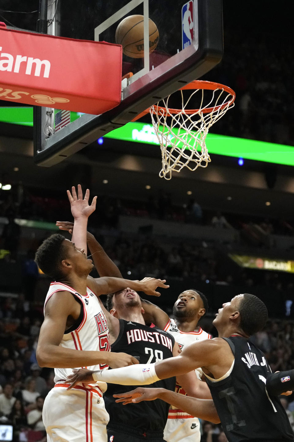 Miami Heat center Orlando Robinson (25) and forward Haywood Highsmith, right, defend against Houston Rockets center Alperen Sengun (28) during the first half of an NBA basketball game, Friday, Feb. 10, 2023, in Miami. (AP Photo/Lynne Sladky)