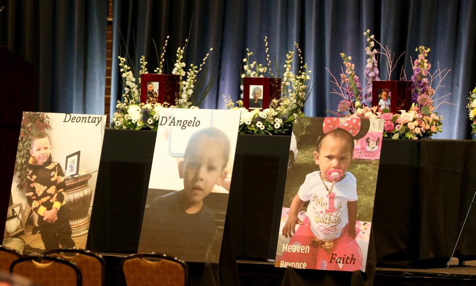Three of the six children’s photos are in the front of the hall Monday, Feb. 5, 2024, at a visitation and memorial service at Century Center in South Bend for the six Smith children killed as a result of the Jan. 21, 2024, fatal house fire on North LaPorte Avenue.