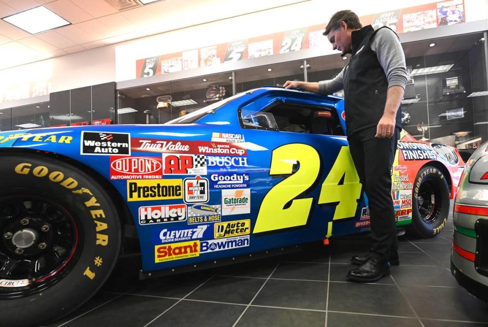 Former NASCAR driver and Hall of Fame member Jeff Gordon looks at the DuPont Chevrolet that he drove to win the Coca-Cola 600 in 1994 on Tuesday, March 21, 2023. Gordon is now the Vice-Chairman for Hendrick Motorsports in Concord, NC.