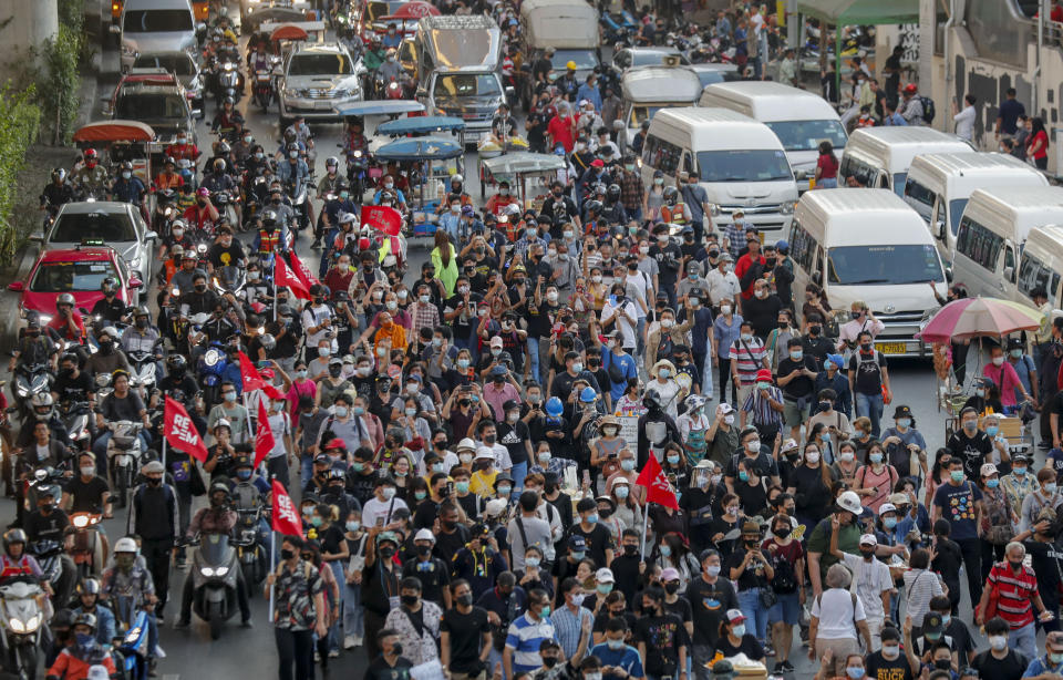 Anti-government protesters march to the criminal court during a protest in Bangkok, Thailand, Saturday, March 6, 2021. A new faction of Thailand's student-led anti-government movement calling itself REDEM, short for Restart Democracy, announced plans to march to Bangkok's Criminal Court Saturday to highlight the plight of several detained leaders of the protest movement. (AP Photo/Sakchai Lalit)