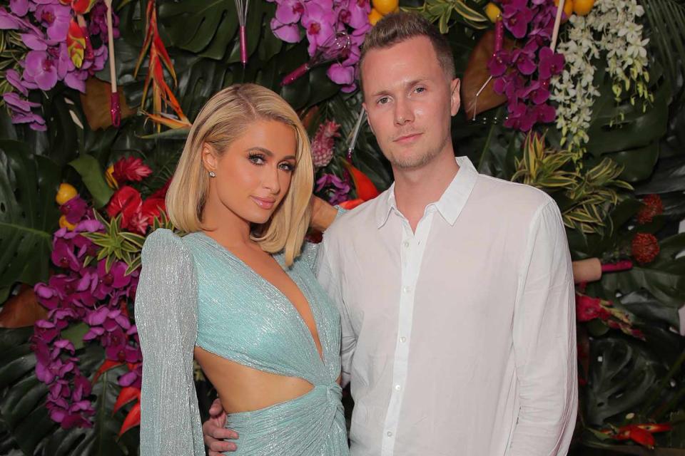 <p>Chelsea Lauren/Shutterstock</p> Paris and Barron Hilton 