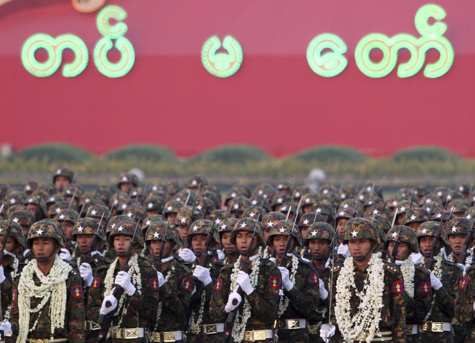 FILE - In this March 27, 2019, file photo, Myanmar military officers march during a parade to commemorate the 74th Armed Forces Day in Naypyitaw, Myanmar. A United Nations fact-finding mission is calling for an embargo on arms sales to Myanmar and targeted sanctions against businesses with connections to the military that it says are helping fund human rights abuses, report released Monday, Aug. 5, 2019. (AP Photo/Aung Shine Oo, File)