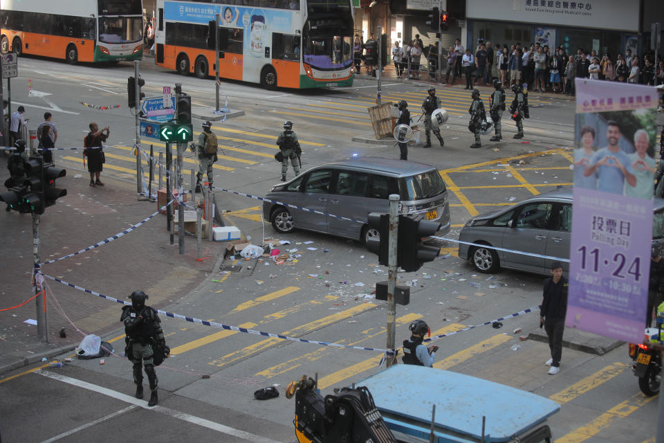 Police cordons off the scene of a morning shooting in Hong Kong Monday, Nov. 11, 2019. Police in Hong Kong shot a protester as demonstrators blocked subway lines and roads during the Monday morning commute. (AP Photo/Kin Cheung)