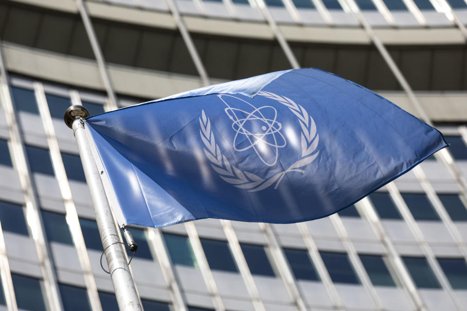 FILE - In this Monday, June 7, 2021 file photo, the flag of the International Atomic Energy Agency (IAEA) waves at the entrance of the Vienna International Center in Vienna. The U.N. atomic watchdog said on Tuesday, Sept. 7 that Iran has continued to increase its stockpile of highly enriched uranium that could be used to make nuclear weapons in contravention of a 2015 accord with world powers that was meant to contain Tehran's nuclear program. The IAEA also told member states in its confidential quarterly report Tuesday that its verification and monitoring activities have been “seriously undermined” since February by Iran's refusal to let inspectors access IAEA monitoring equipment. (AP Photo/Lisa Leutner, file)