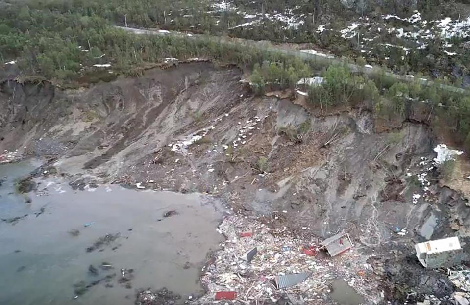 The scene of a landslide near Alta, Arctic Norway, seen Wednesday June 3, 2020, after a powerful landslide that took eight houses into the sea off northern Norway. Police spokesman Torfinn Halvari said a car was taken in the landslide but no people injured. (Anders Bjordal via AP)