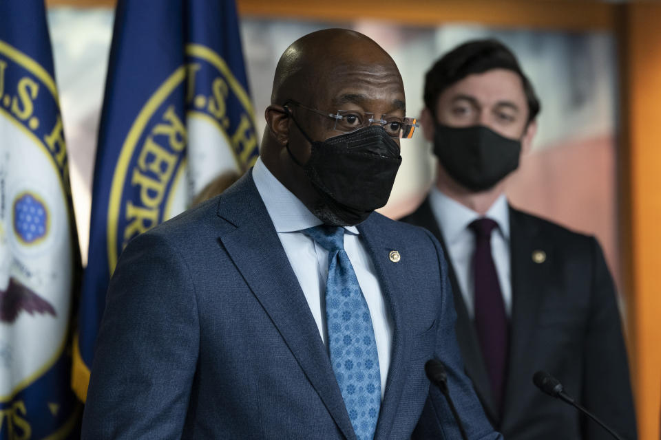 Sen. Raphael Warnock, D-Ga., left, accompanied by Sen. Jon Ossoff, D-Ga., speaks during a news conference, before the vote on the Democrat's $1.9 trillion COVID-19 relief bill, on Capitol Hill, Wednesday, March 10, 2021, in Washington. (AP Photo/Alex Brandon)