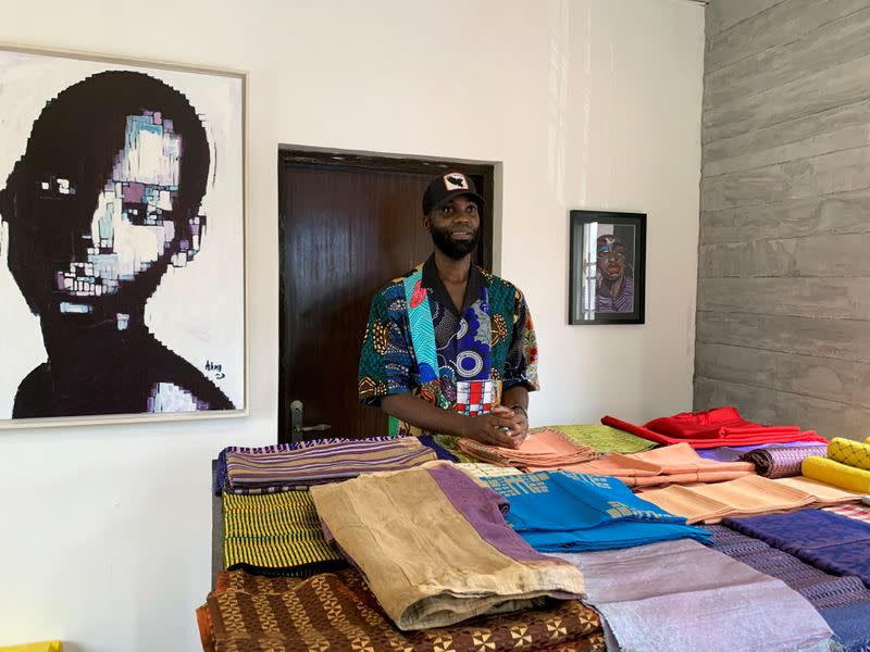 Fashion designer Tsemaye Binitie stands by his custom Aso-Oke fabrics during a workshop in Lagos