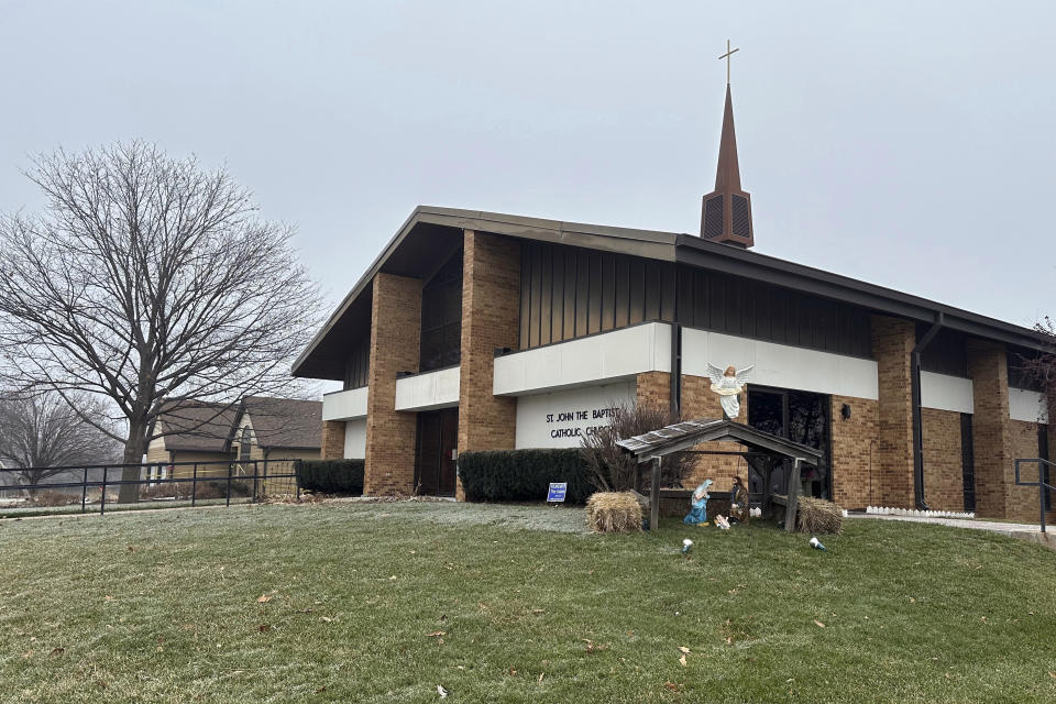 A nativity display sits outside St. John the Baptist Catholic Church, Wednesday morning, Jan. 3, 2024, in Fort Calhoun, Neb. Kierre Williams is charged with fatally stabbing Rev. Stephen Gutgsell, a small-town priest, during a Dec. 10 break in at the home where the priest lived next to the church in Fort Calhoun. ( (AP Photo/Josh Funk)