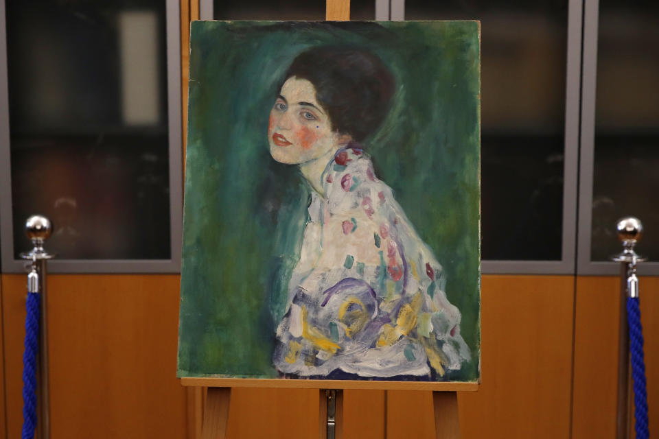 The painting which was found last December near an art gallery and believed to be the missing Gustav Klimt's painting ‘Portrait of a Lady’ is displayed during a press conference in Piacenza, Italy, Friday, Jan. 17, 2020. Art experts have confirmed that a stolen painting discovered hidden inside an Italian art gallery's walls is Gustav Klimt's "Portrait of a Lady," Italian prosecutors said Friday. A gardener reported finding an art work inside a bag last month while clearing ivy at the Ricci Oddi Modern Art Gallery in the northern city of Piacenza. “Portrait of a Lady” disappeared from the gallery during renovation work in February 1997. (AP Photo/Antonio Calanni)