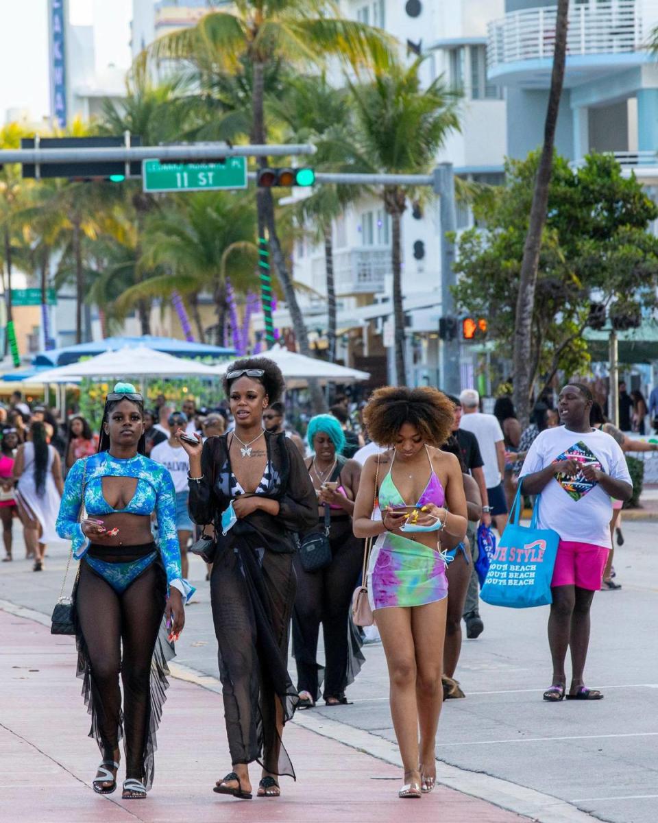 Spring breakers crowd Ocean Drive just before curfew at 8 p.m. in Miami Beach, Florida, on Saturday, March 27, 2021.