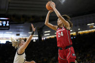 Georgia forward Brittney Smith (24) shoots over Iowa forward Monika Czinano, left, in the first half of a second-round college basketball game in the NCAA Tournament, Sunday, March 19, 2023, in Iowa City, Iowa. (AP Photo/Charlie Neibergall)