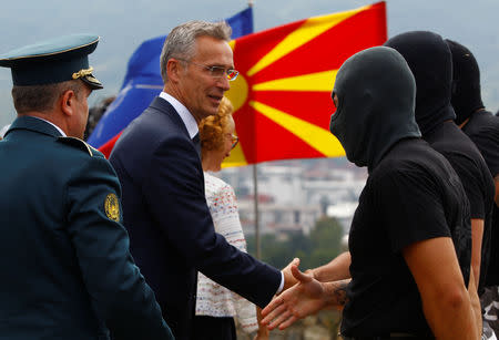 NATO Secretary-General Jens Stoltenberg and Macedonian Defence Minister Radmila Sekerinska attend the Macedonian Army special forces presentation at the army barracks in Skopje, Macedonia, September 6, 2018. REUTERS/Ognen Teofilovski