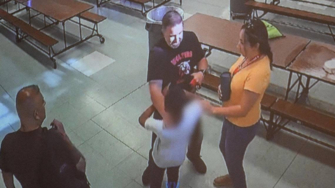 A screenshot from a video clip provided by the Fresno Unified School District shows Wolters Elementary School Principal Brian Vollhardt shoving a special needs student at the school on June 7, 2022. The former principal has been charged with child abuse and endangerment and a warrant has been issued for his arrest, the Fresno Police Department confirmed.