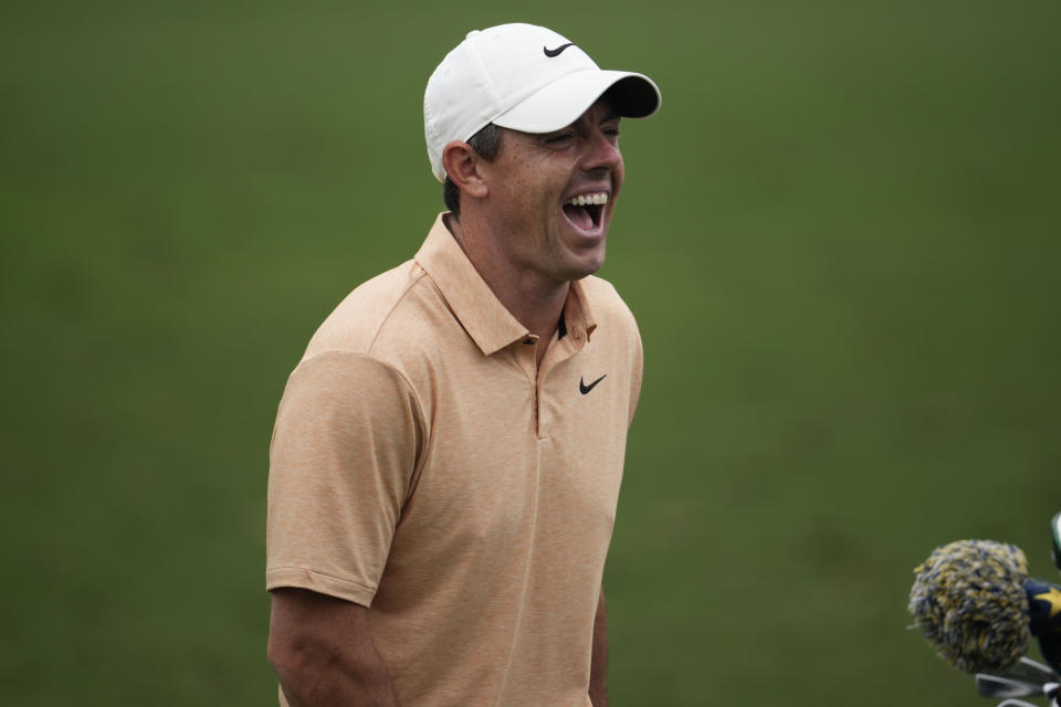 Rory McIlroy, of Northern Ireland, works out on the range during a practice for the Masters golf tournament at Augusta National Golf Club, Tuesday, April 4, 2023, in Augusta, Ga. (AP Photo/Matt Slocum)