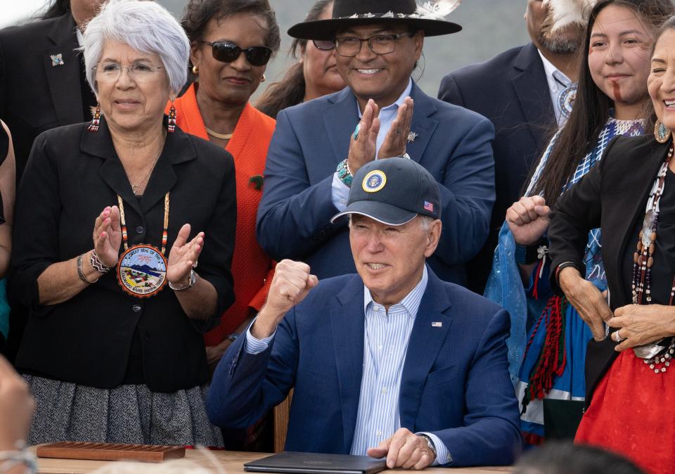 President Joe Biden reacts after singing the proclamation creating the Baaj Nwaavjo I'tah Kukveni - Ancestral Footprints of the Grand Canyon National Monument on Aug. 8, 2023, at the historic Red Butte Airfield near Tusayan, Ariz.