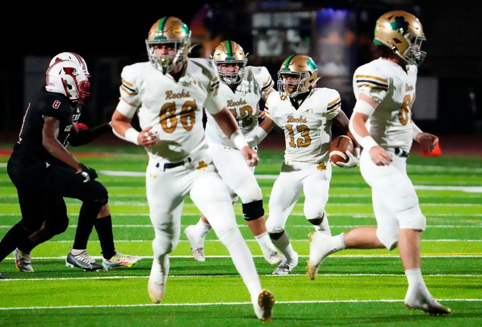 Yuma Catholic Shamrocks wide receiver Darryl Coleman (13) carries the ball against the Glendale Cardinals during a game at Glendale High School in Glendale on Oct. 21, 2022.