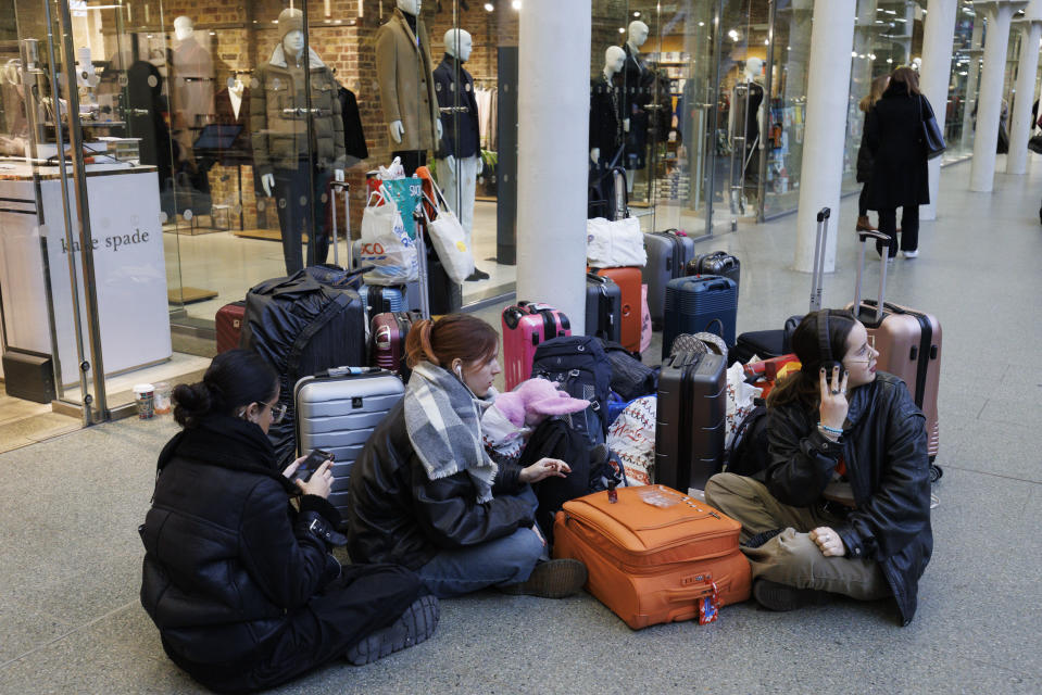 LONDON, ENGLAND - DECEMBER 22: Passengers queue ahead of boarding the Eurostar train at King's Cross St Pancras on December 22, 2023 in London, England. Travel disruptions persist since Storm Pia hit the UK on Thursday, compounded by a sudden French strike, leading to widespread cancellations and leaving Eurostar passengers stranded. (Photo by Belinda Jiao/Getty Images)