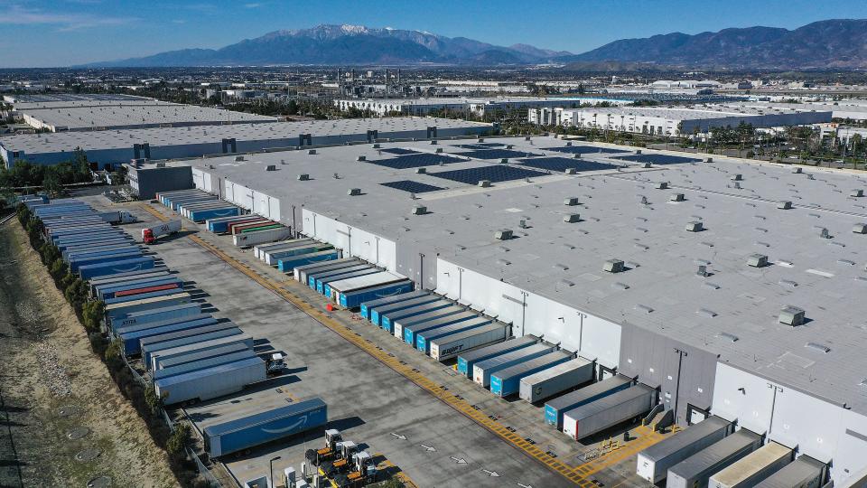Large warehouses including an Amazon fulfillment center dominate the landscape in San Bernardino, Calif., Wednesday, January 26, 2022.