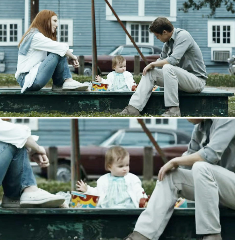 the baby sitting outside in a playground