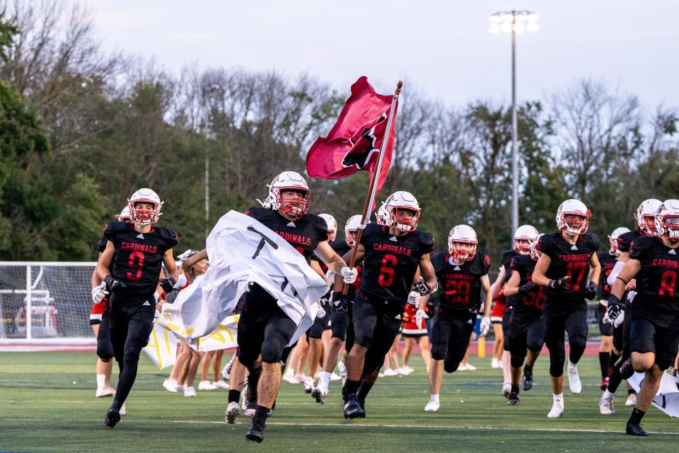 Westwood High School hosts River Dell in a football game in Washington Township on Friday September 16, 2022. The Westwood Cardinals enter the field. 