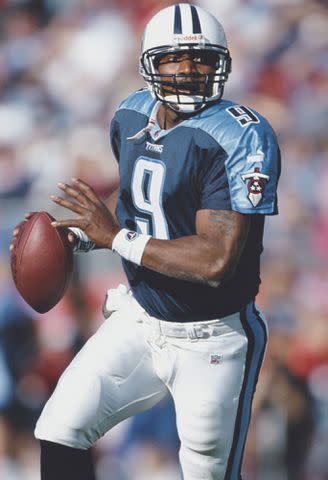 <p>Andy Lyons/Getty</p> Steve McNair runs the ball during the American Football Conference Central game against the Pittsburgh Steelers on November 5, 2000.