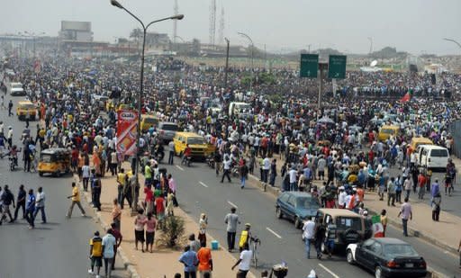 Thousands of protesters gather at Gani Fawehinmi Park in Lagos. Tens of thousands of protesting Nigerians defied an order to end a three-day-old strike Wednesday as unions threatened oil production and a mob rampaged in one city, leaving a police officer dead