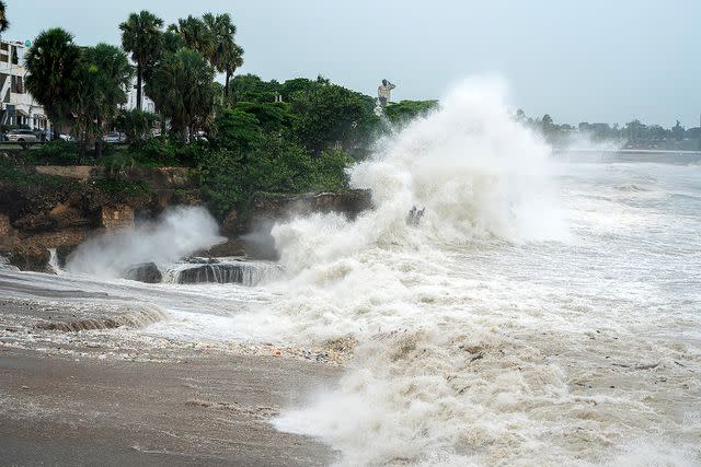 <p>FRANCESCO SPOTORNO/AFP via Getty</p> High tides are pictured after Hurricane Beryl in Santo Domingo on July 2, 2024.