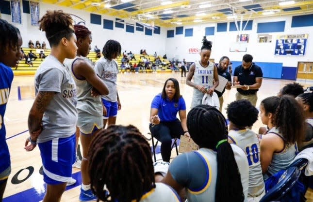 IRSC head coach Jamarra Robinson speaks to her team during a timeout. Date unknown.