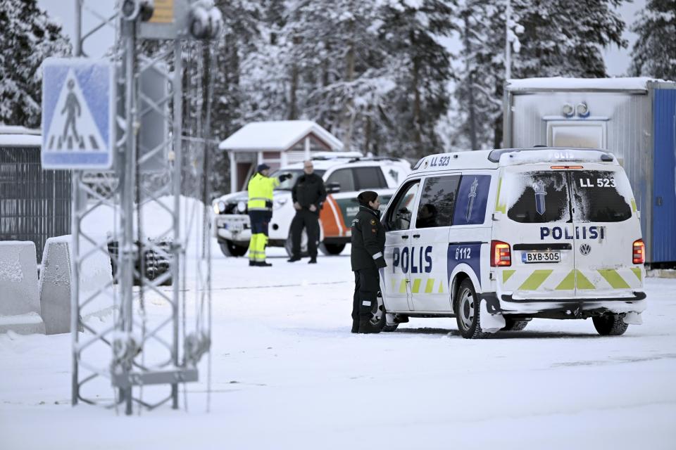 Finnish border guards and police at the Raja-Jooseppi international border crossing station in Inari, northern Finland, Friday, Nov. 24, 2023. On Wednesday, Finnish border guards and soldiers began erecting barriers, including concrete obstacles topped with barbed-wire at some crossing points on the Nordic country’s lengthy border with Russia. (Emmi Korhonen./Lehtikuva via AP)