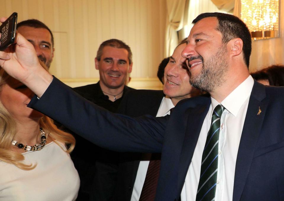 Italian Deputy Premier and Interior Minister Matteo Salvini takes a selfie as he arrives at the association 'Friends of the Opera', in Milan, Italy, March 9, 2019. Italy's coalition government frayed further Friday over the stalled high-speed rail line to France, with the League insisting it go ahead and the 5-Star Movement refusing to fund the next phase until the whole deal is renegotiated. (Mateo Bazzi/ANSA via AP)