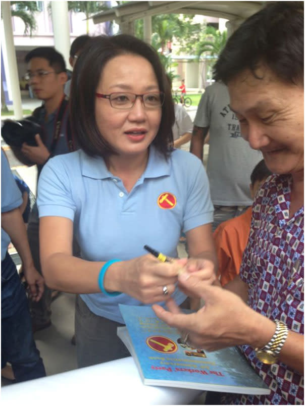 Workers' Party chairman Sylvia Lim arrives at their parade starting site to cheers.