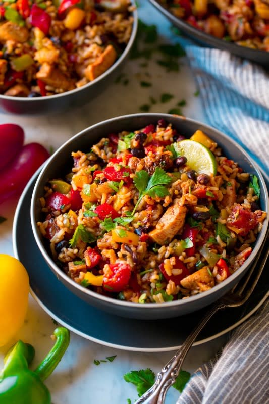 <p>Cooking Classy</p><p>Easy Chicken Fajita Rice Bowl made in one pan! It’s a simple chicken, black bean and rice Tex-Mex style dish that’s brimming with well-seasoned, fresh flavor. With its simplicity and satisfying flavor it’s destined to become a new go-to dinner!</p><p><strong>Get the recipe: <a href="https://www.cookingclassy.com/chicken-fajita-rice-bowl/" rel="nofollow noopener" target="_blank" data-ylk="slk:Vietnamese Grilled Chicken Rice Bowls;elm:context_link;itc:0;sec:content-canvas" class="link rapid-noclick-resp">Vietnamese Grilled Chicken Rice Bowls</a></strong></p>