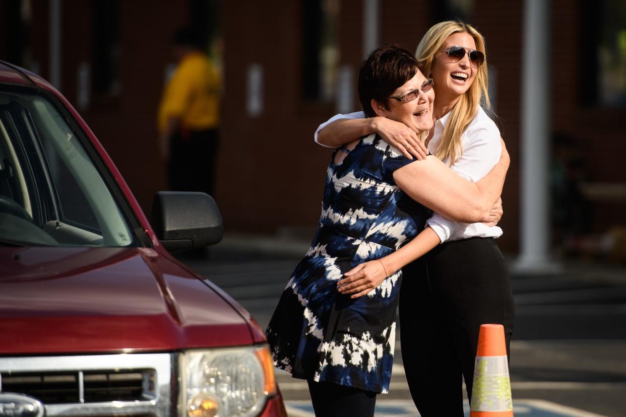 Ivanka Trump hugs Lisa Cummings at a disaster relief site on Wednesday, Oct. 3, 2018, at Hyde Park Baptist Church in Lumberton. Cummings was in line for meals at the disaster relief site. [Andrew Craft/The Fayetteville Observer]