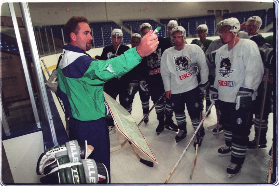 Detroit Whalers coach Pete DeBoer speaks to the team during a practice on Sept. 18, 1996.