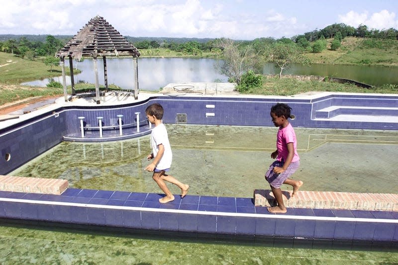 Children play at Escobar's abandoned ranch.