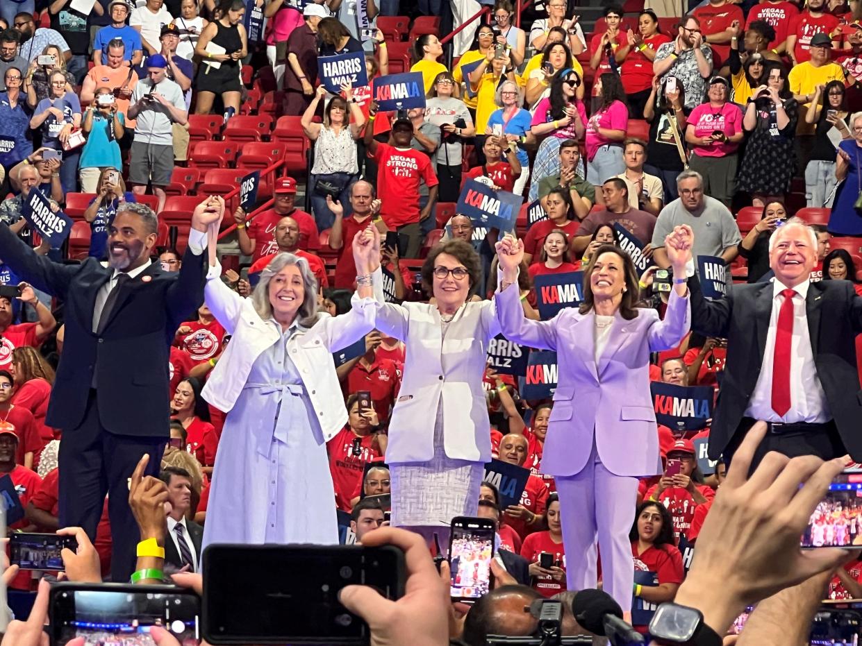 From left: U.S. Rep. Steven Horsford, U.S. Rep Dina Titus, Sen. Jacky Rosen, Vice President Kamala Harris and Minnesota Gov. Tim Walz take a bow at the end of a presidential campaign rally in Las Vegas on Aug. 10, 2024.