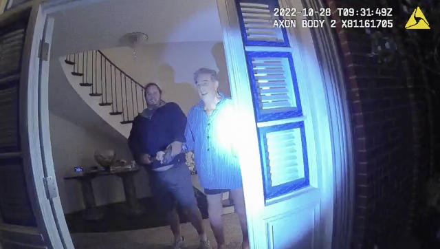 This image from video from police body-worn camera footage, released by the San Francisco Police Department, shows Paul Pelosi, right, fighting for control of a hammer with his assailant, David DePape, during a attack at Pelosi's home in San Francisco on Oct. 28, 2022. DePape wrests the tool from Pelosi and lunges toward him the hammer over his head. The blow to Pelosi occurs out of view of the video as officers rush into the house and subdue DePape.(San Francisco Police Department via AP)