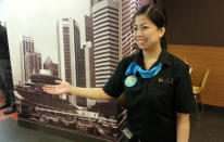 Floor staff deployed to direct customers to individual counters and control the crowd flow. (Yahoo! Photo)