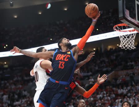 Apr 23, 2019; Portland, OR, USA; Oklahoma City Thunder forward Paul George (13) shoots over Portland Trail Blazers center Enes Kanter (00) in the second half of game five of the first round of the 2019 NBA Playoffs at Moda Center. Mandatory Credit: Jaime Valdez-USA TODAY Sports