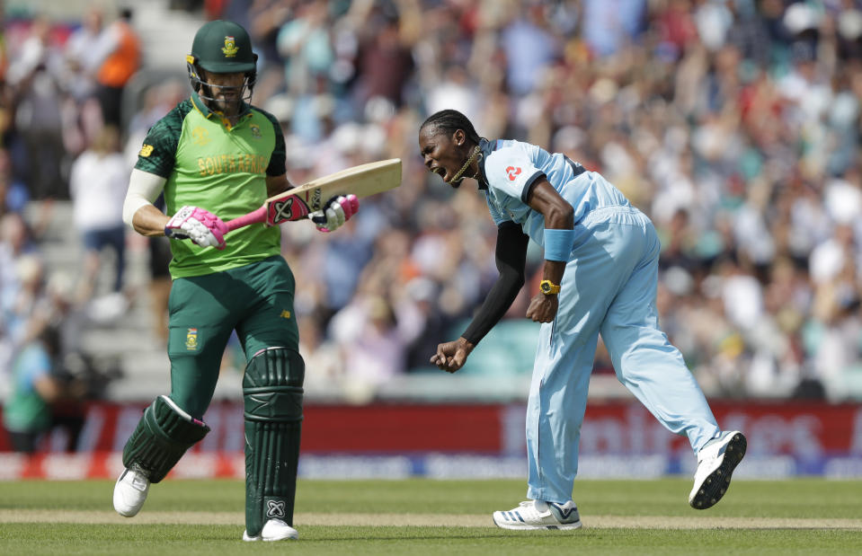 England's Jofra Archer celebrates taking the wicket of South Africa's captain Faf du Plessis, left, during the World Cup cricket match between England and South Africa at The Oval in London, Thursday, May 30, 2019. (AP Photo/Kirsty Wigglesworth)