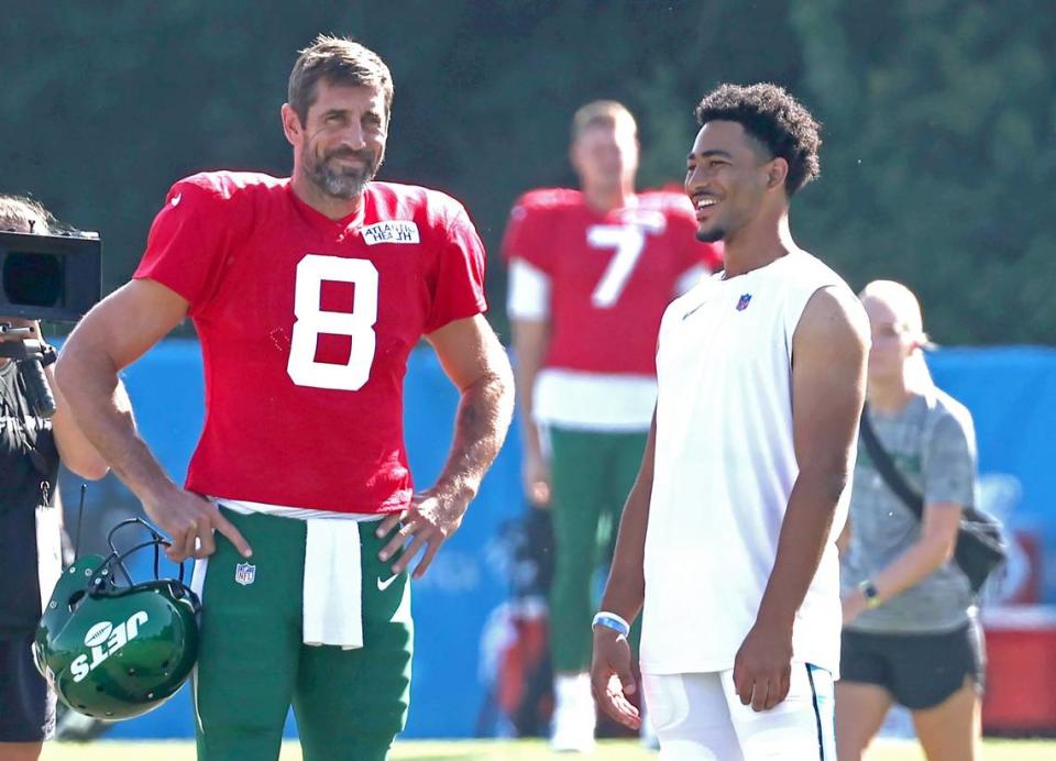 New York Jets quarterback Aaron Rodgers, left and Carolina Panthers quarterback Bryce Young, right, talk prior to the team’s joint practice at Wofford College in Spartanburg, SC on Wednesday, August 9, 2023.